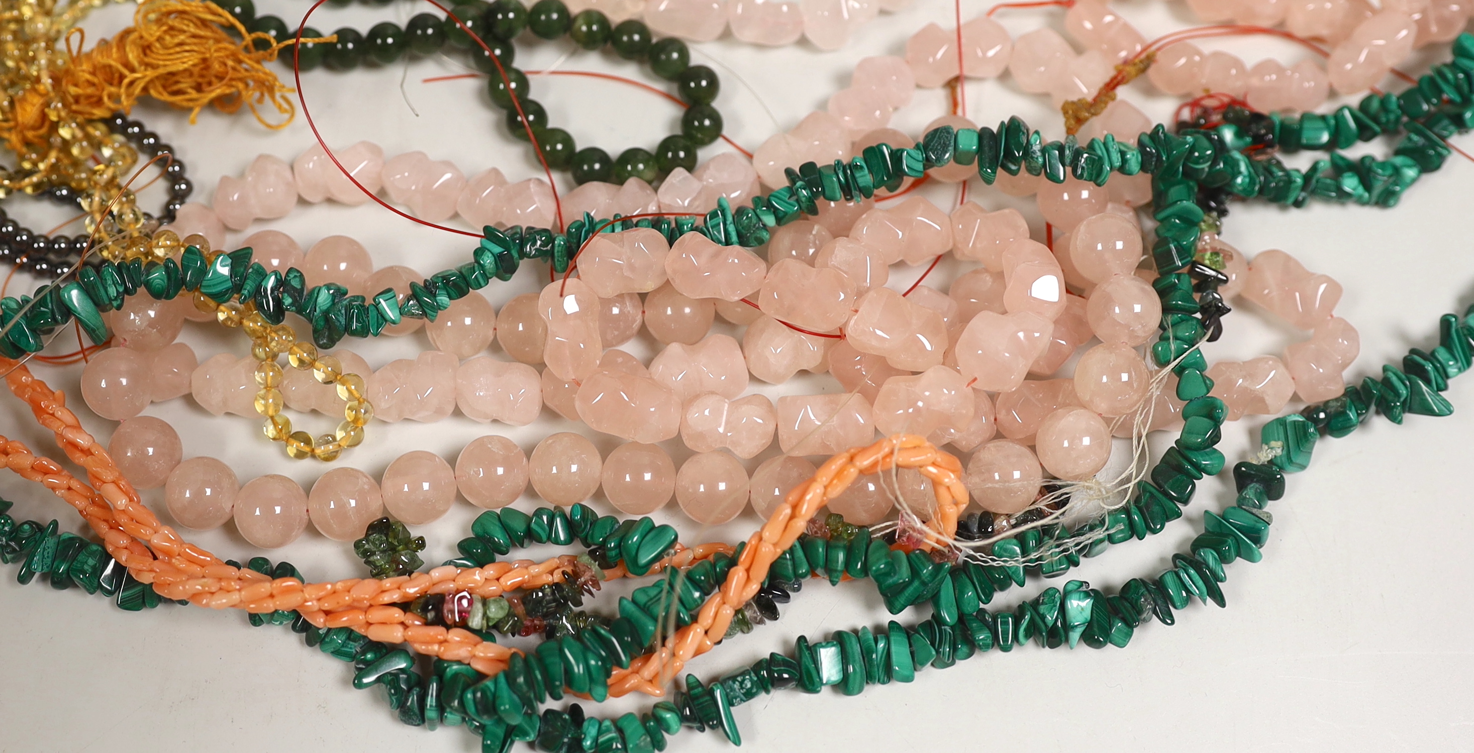 Assorted necklaces including malachite, agate and pink quartz.